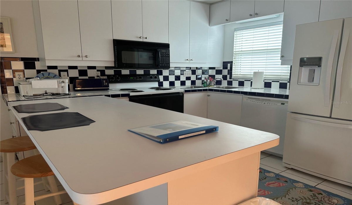Kitchen with bar seating.