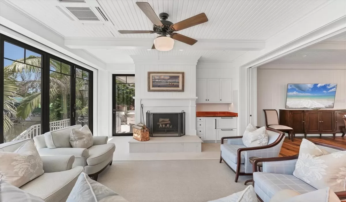 The living room includes a dry bar that features a copper countertop, Monogram BeverageDrawers, Scotsman Ice-Maker