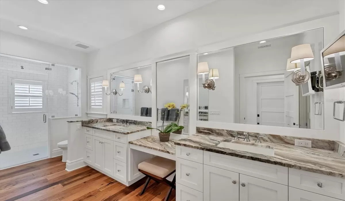Primary Bathroom with dual vanities and beauty station