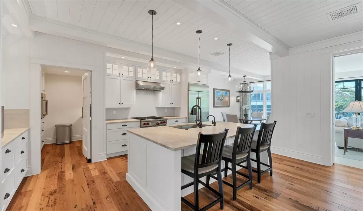 Gorgeous kitchen with convenient butler's pantry that includes a wet bar.